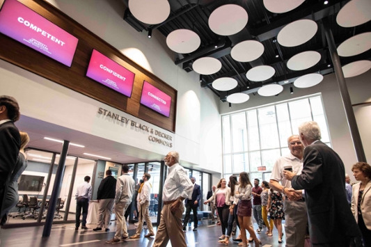 Students, faculty, staff, and donors enter the addition for a tour.